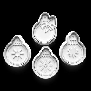 Set of four white Christmas bauble cookie cutters for festive baking, with elegant designs on a black background.