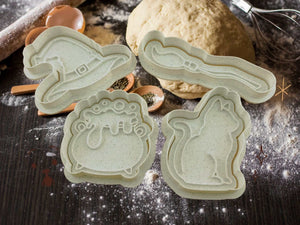 Halloween cookie cutters with witch hat, broom, cauldron, and cat designs, perfect for spooky baking fun.
