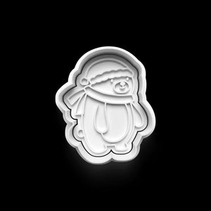 Festive cookie cutter shaped like a cute polar bear for holiday baking.