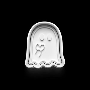 Ghost-shaped cookie cutter with a heart design for Halloween baking fun.