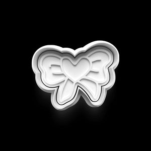 Heart-shaped bow cookie cutter for Valentine's Day baking.