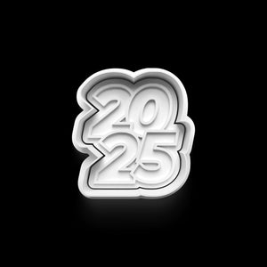 "2025" cookie cutter on black background for New Year baking projects.