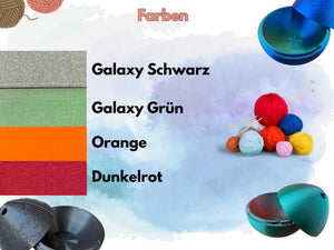 Farben der Garnschale: Galaxy Schwarz, Galaxy Grün, Orange, Dunkelrot und verschiedene Wollknäuel.