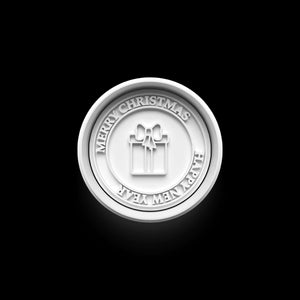 Festive cookie stamp with 'Merry Christmas & Happy New Year' text and gift design on a black background.