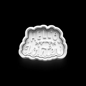 White "Hello Winter" cookie cutter for festive baking on a black background, perfect for holiday cookies.