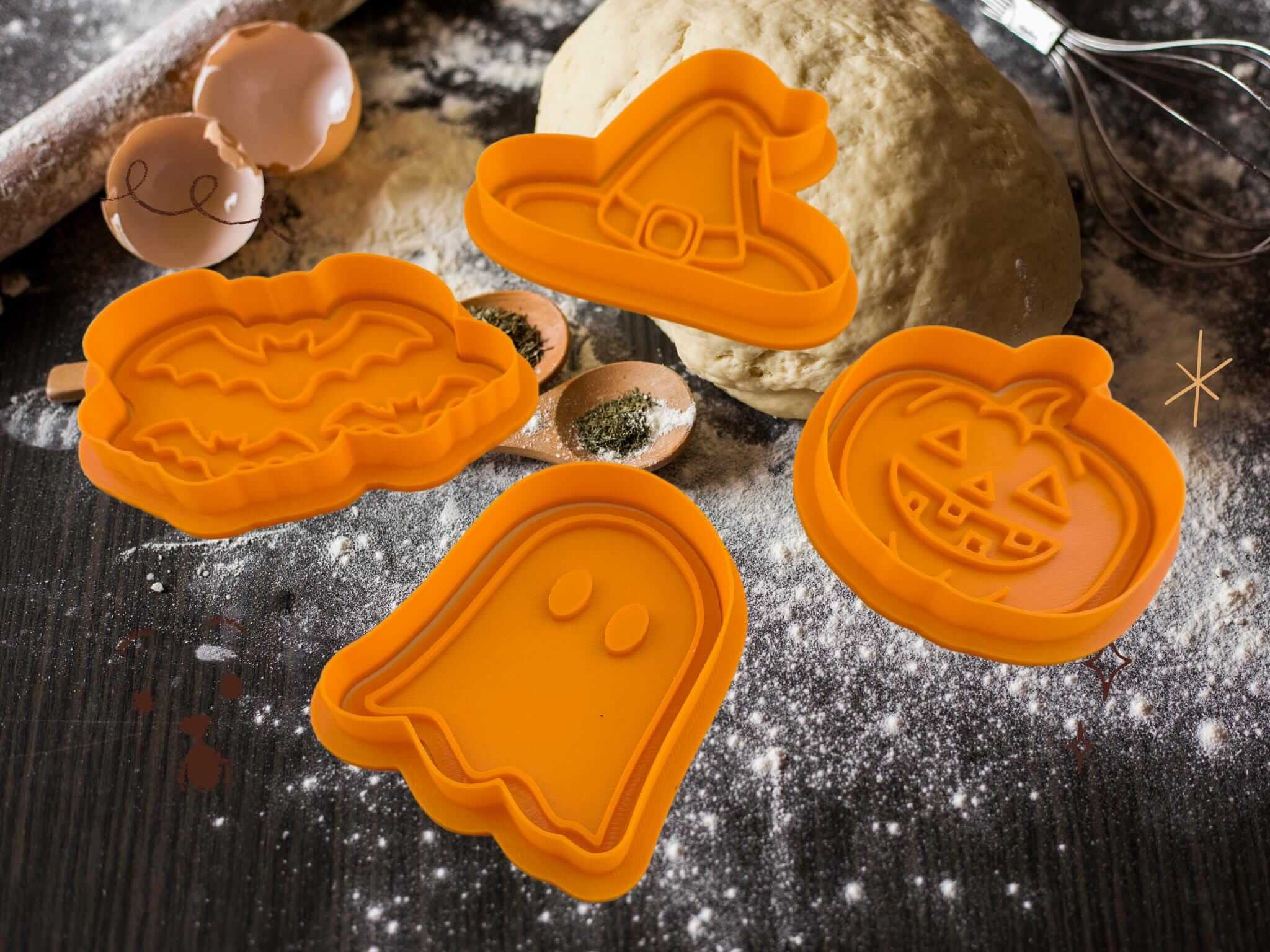 Halloween cookie cutters set in orange: pumpkin, ghost, bat, witch hat for spooky baking fun!