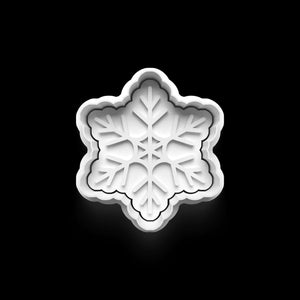 Snowflake-shaped cookie cutter for winter baking, perfect for creating festive cookies.