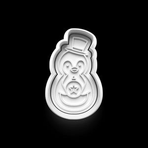 Adorable penguin cookie cutter from the 4-piece winter set on a black background, perfect for festive baking and Christmas fun.