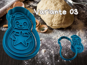 Pinguin Keks Ausstecher Set im Einsatz: Fröhliche Pinguin-Ausstechform für winterliche Plätzchen auf einem bemehlten Tisch.