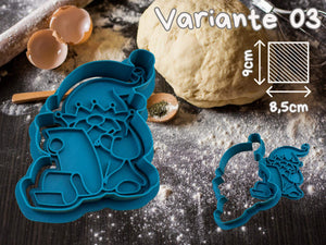 Festive gnome cookie cutter in blue on a baking table with dough and eggs, perfect for making holiday cookies. Size 9x8.5cm.