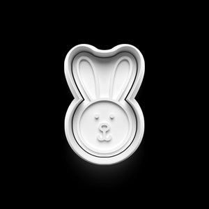 White bunny-shaped cookie cutter on a black background, perfect for Easter baking and creative kitchen projects.