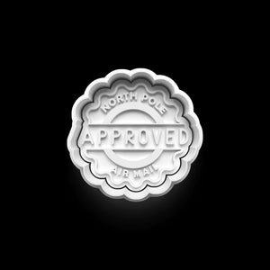 Festive "North Pole Approved" cookie stamp with scalloped edges, perfect for creating holiday-themed cookies. 🍪🎅