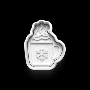 Winter-themed cookie cutter shaped like a steaming cup with a snowflake, perfect for festive baking. Durable PETG plastic.