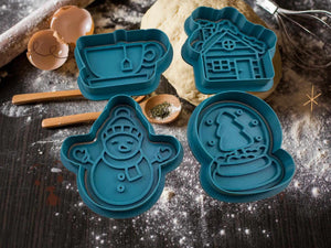Festive cookie cutters set with snowman, teacup, snow globe, and house designs on a rustic baking table, perfect for Christmas baking.
