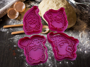 Valentinstag Gnome cookie cutters with heart designs on a rustic kitchen counter.
