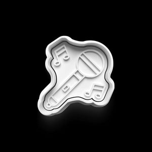Microphone-shaped cookie cutter with musical notes, perfect for music-themed baking.