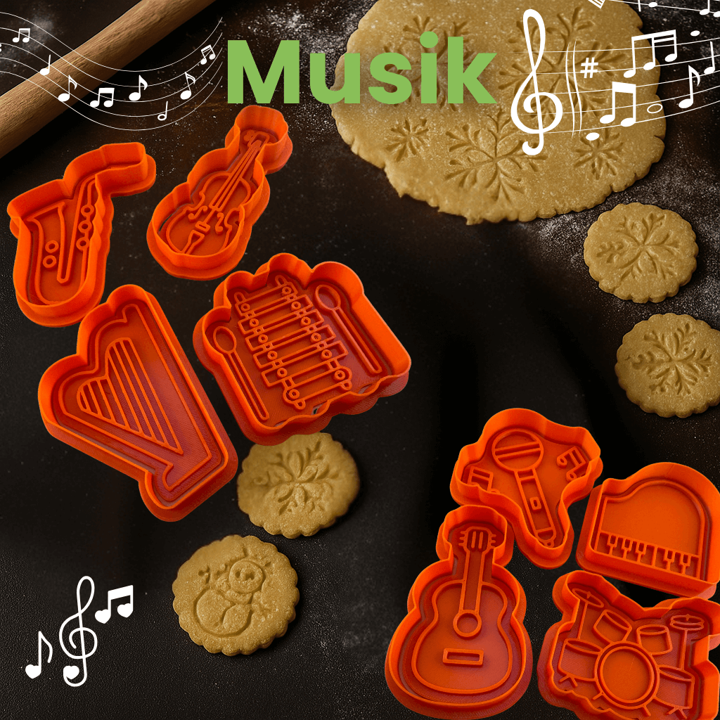 Music-themed cookie cutters on dough: guitar, microphone, and piano shapes for baking fun.