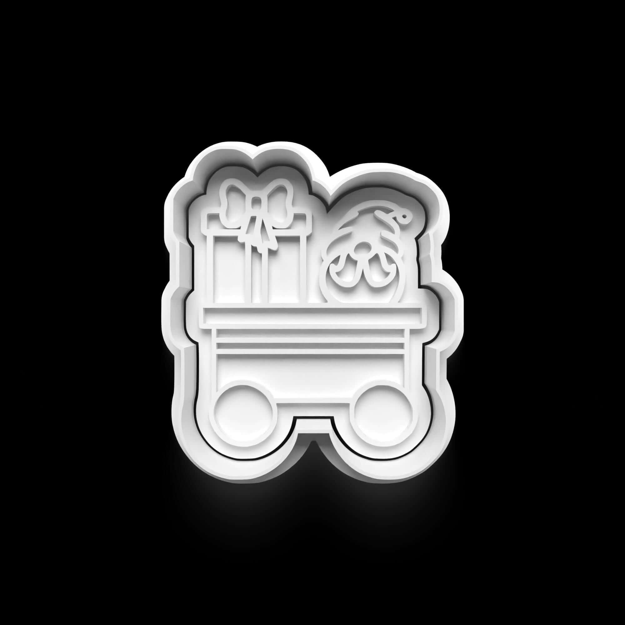 Festive cookie cutter shaped like a train car loaded with Christmas gifts, perfect for holiday baking.