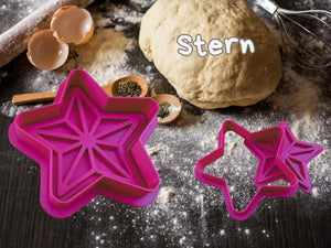 Pink star-shaped cookie cutter on dough, perfect for festive baking and Christmas treats.