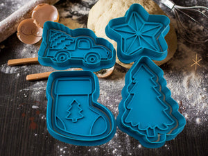 Blue Christmas cookie cutters: tree, star, truck, and boot shapes on a flour-dusted surface for festive baking.