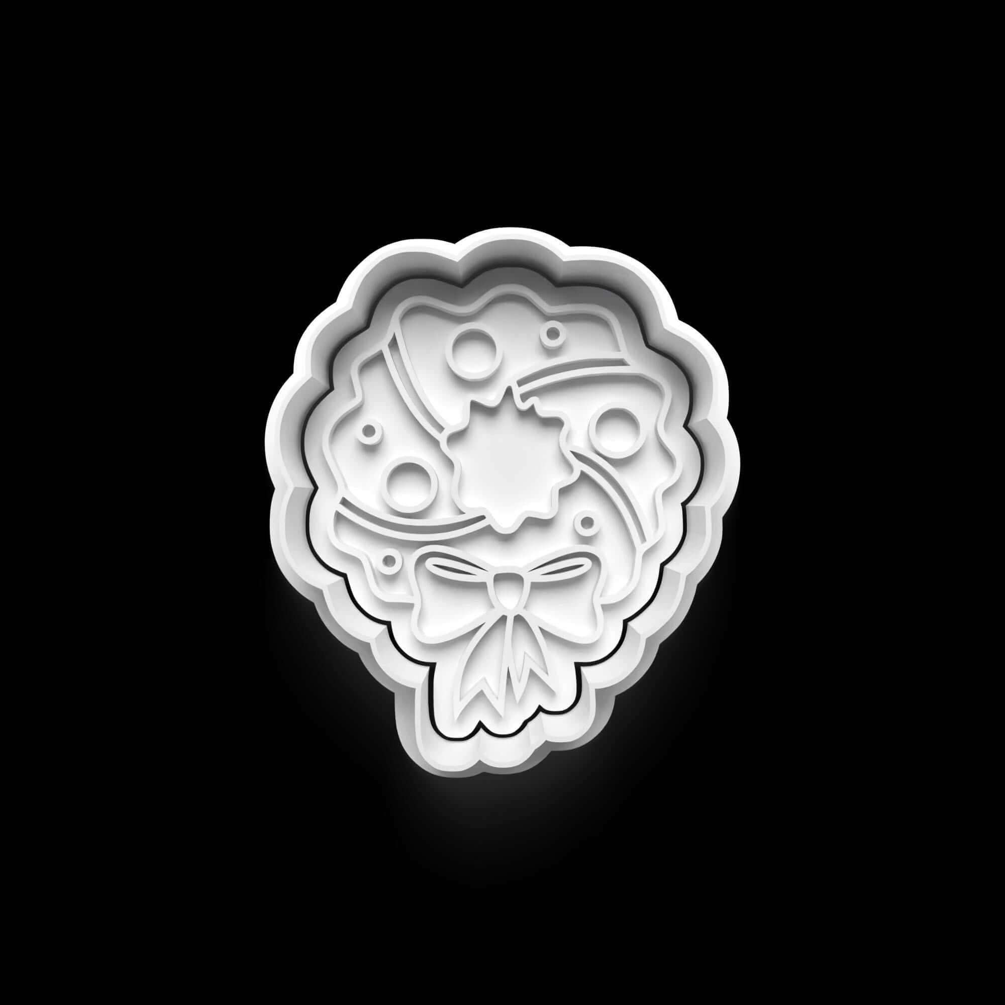 Weihnachtskeksausstecher in Form eines festlichen Kranzes für gemütliche Backnachmittage.